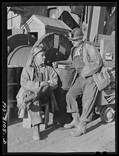 Butte, Montana. Anaconda Copper Mining Company. Shaftmen at the headframe of copper mine waiting to go down in the cage