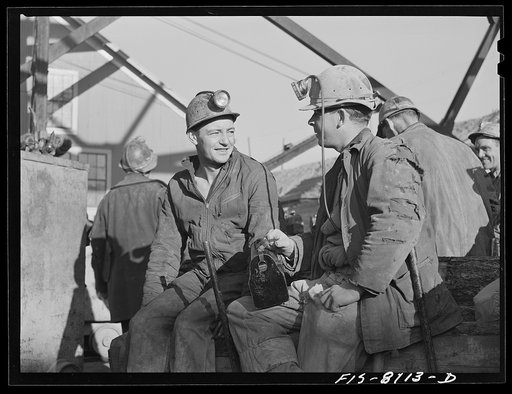 Butte, Montana. Anaconda Copper Mining Company. Miners on the surface waiting to go down in the cage