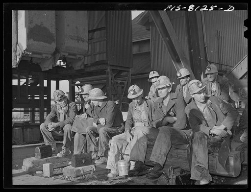 Butte, Montana. Anaconda Copper Mining Company. Group of copper miners awaiting their turn to be taken below by the cage