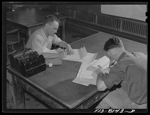 Butte, Montana. Anaconda Copper Mining Company. Working on contracts to determine pay for miners. The contract system is used in the Butte mines, where the minimum basic wage is six dollars and seventy-five cents daily