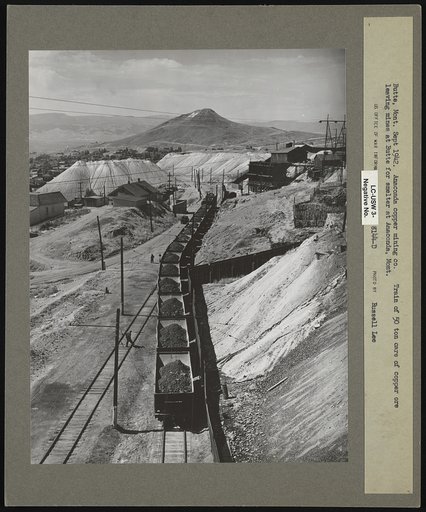 Butte, Montana. Anaconda Copper Mining Company. Train of fifty-ton cars of copper ore leaving mines at Butte for smelter at Anaconda, Montana