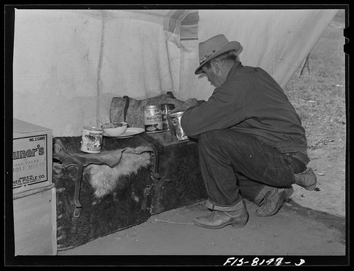 Gravelly Range, Madison County, Montana. Sheepherder getting supplies from a box