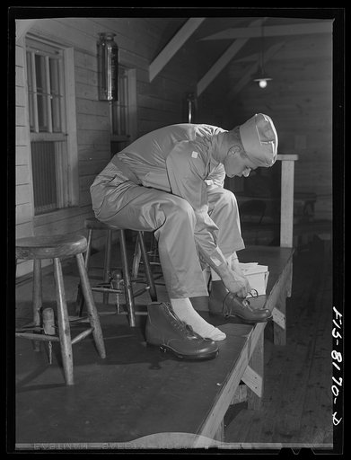Fort Belvoir, Virginia. Issuing shoes to George Camblair at the clothing warehouse at camp