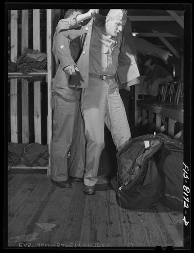 Untitled photo, possibly related to: Fort Belvoir, Virginia. At the clothing warehouse George Camblair started with nothing and comes out completely equipped with clothing