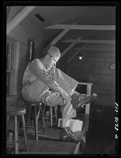 Fort Belvoir, Virginia. Issuing shoes to George Camblair at the clothing warehouse camp
