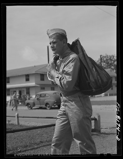 Fort Belvoir, Virginia. George Camblair leaving the warehouse to join other inductees for inspection