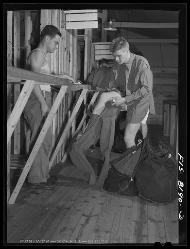 Fort Belvoir, Virginia. George Camblair getting his trousers at the clothing warehouse