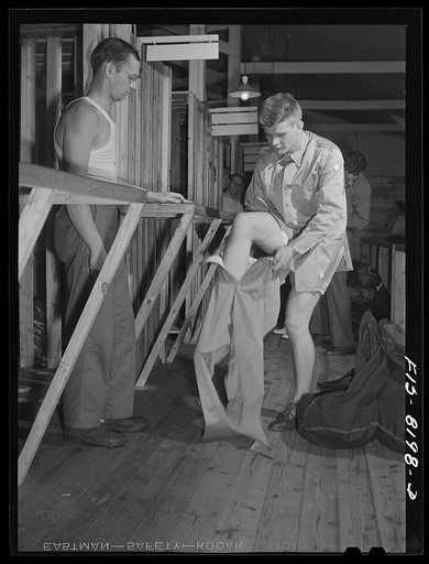 Fort Belvoir, Virginia. George Camblair getting his trousers at the clothing warehouse
