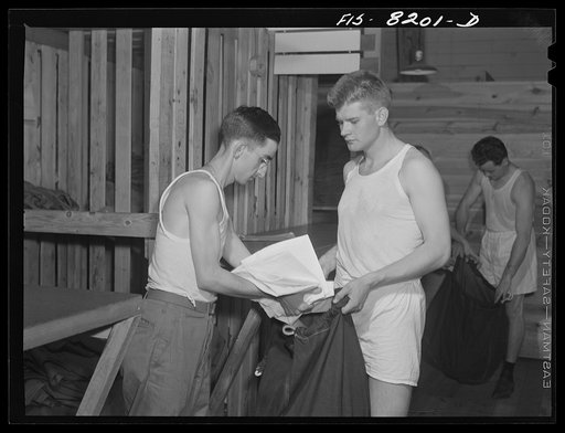 Fort Belvoir, Virginia. At the clothing warehouse George Camblair started with nothing and comes out completely equipped with clothing