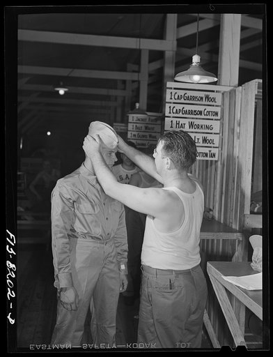 Fort Belvoir, Virginia. At the clothing warehouse George Camblair started with nothing and comes out completely equipped with clothing