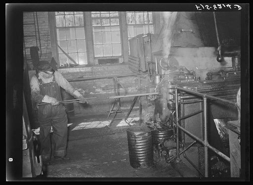 Butte, Montana. Anaconda Copper Mining Company. First step in making bits for a pneumatic drilling machine is to heat a rod of the proper size; this rod is placed into machine which punches and forms the bit; this process is called drop forging. Bit plant of the Anaconda Copper Mining Company