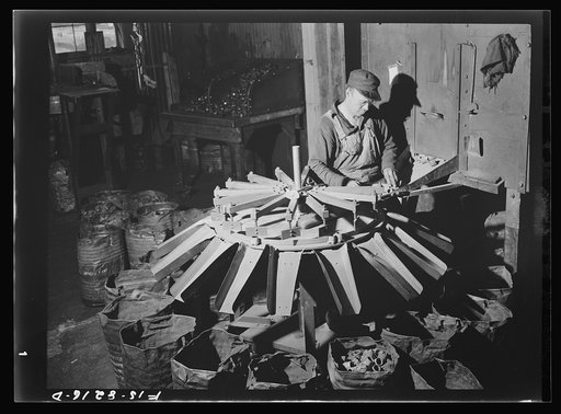 Untitled photo, possibly related to: Butte, Montana. Anaconda Copper Mining Company. Bits for the pneumatic drilling machines are classified as to length of shaft in this automatic machine; a segregation of bits to one-thirty-secondth of an inch is maintained