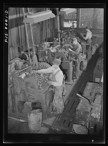 Butte, Montana. Anaconda Copper Mining Company. Sharpening bits to be used in pneumatic drills in the copper mines