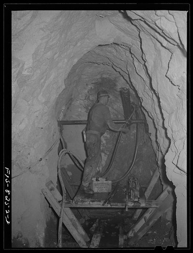 Butte, Montana. Anaconda Copper Mining Company. Drilling in the ore body of a copper mine