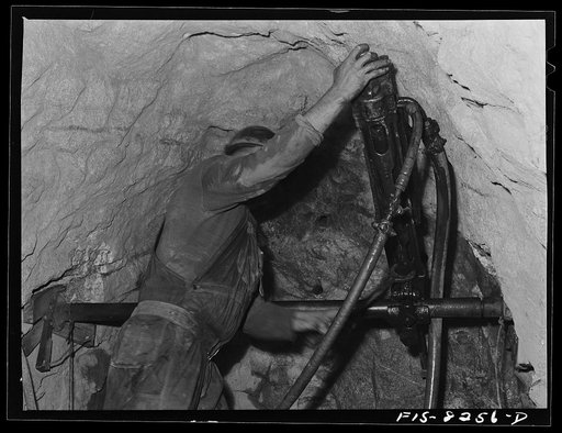 Untitled photo, possibly related to: Butte, Montana. Anaconda Copper Mining Company. Drilling in the ore body of a copper mine
