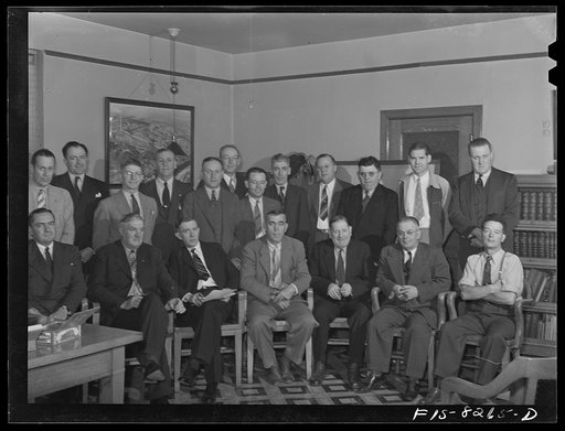 Untitled photo, possibly related to: Butte, Montana. Anaconda Copper Mining Company. The victory labor-management production committee of the Butte mines meets regularly. In the back row from left to right are: J.A. Livingston, Anaconda Copper Mining Company; E.I. Renouard, assistant general superin