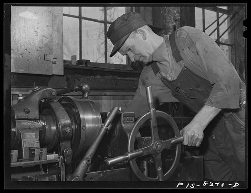 Butte, Montana. Anaconda Copper Mining Company. Machinist at a lathe in machine shop