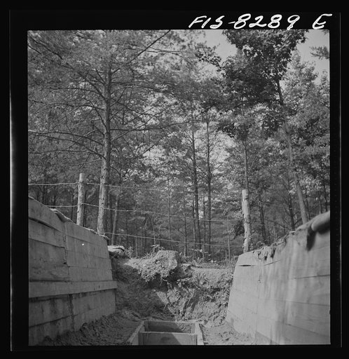 Untitled photo, possibly related to: Fort Belvoir, Virginia. Sergeant George Camblair getting rigorous physical training on the obstacle course