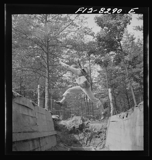 Fort Belvoir, Virginia. Sergeant George Camblair getting rigorous physical training on the obstacle course