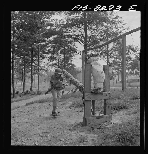 Untitled photo, possibly related to: Fort Belvoir, Virginia. Sergeant George Camblair learning to use the bayonet