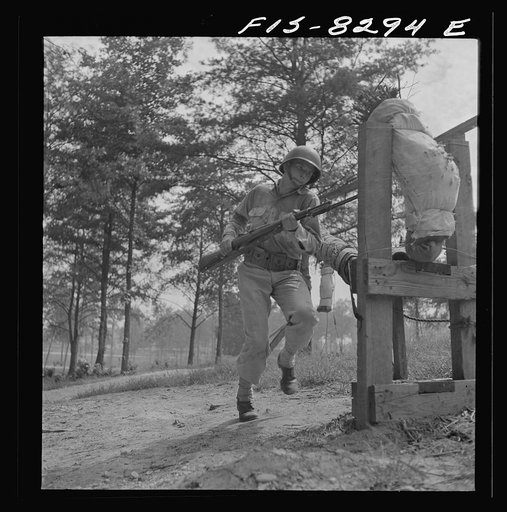 Fort Belvoir, Virginia. Sergeant George Camblair getting rigorous physical training on the obstacle course
