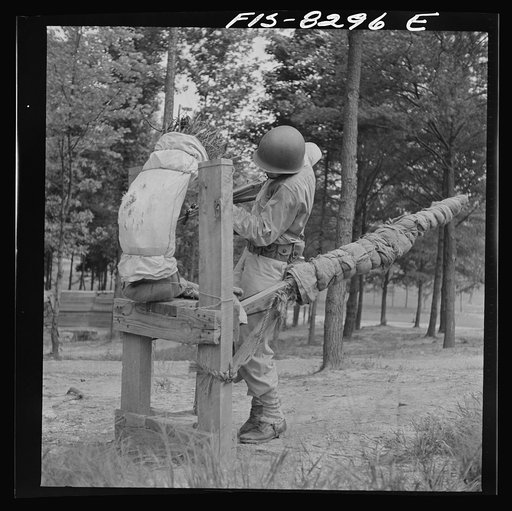 Untitled photo, possibly related to: Fort Belvoir, Virginia. Sergeant George Camblair learning to use the bayonet