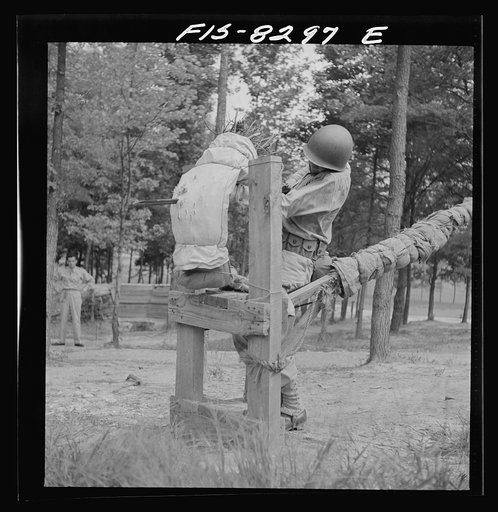 Untitled photo, possibly related to: Fort Belvoir, Virginia. Sergeant George Camblair learning to use the bayonet