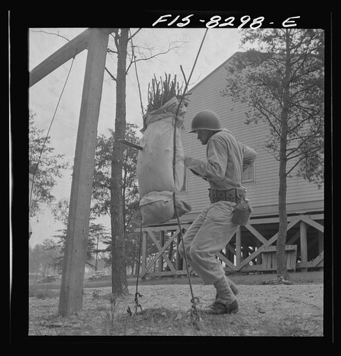 Untitled photo, possibly related to: Fort Belvoir, Virginia. Sergeant George Camblair learning to use the bayonet