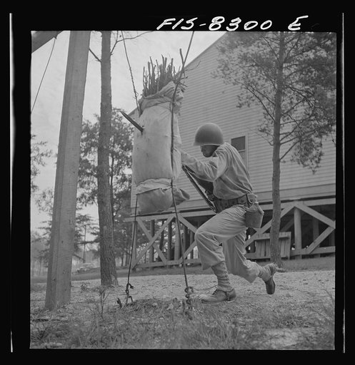 Untitled photo, possibly related to: Fort Belvoir, Virginia. Sergeant George Camblair learning to use the bayonet