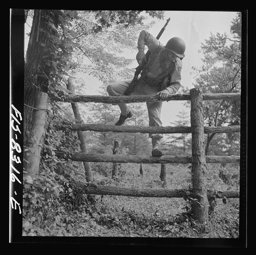 Fort Belvoir, Virginia. Sergeant George Camblair getting rigorous physical training on the obstacle course