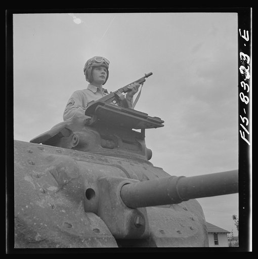 Fort Belvoir, Virginia. Sergeant George Camblair learning the operation of a tank