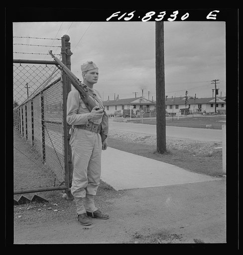 Untitled photo, possibly related to: Fort Belvoir, Virginia. Sergeant George Camblair on sentry duty at camp