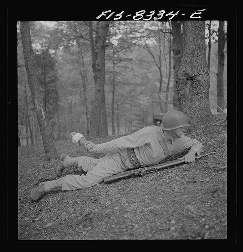 Fort Belvoir, Virginia. Sergeant George Camblair learning how to use a "Molotov cocktail"