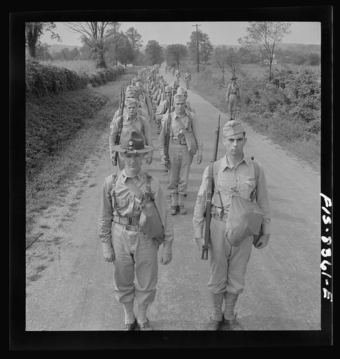Fort Belvoir, Virginia (vicinity). Sergeant George Camblair on a march along the road near camp
