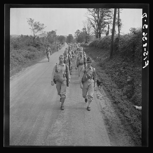 Fort Belvoir, Virginia (vicinity). Sergeant George Camblair on a march along the road near camp