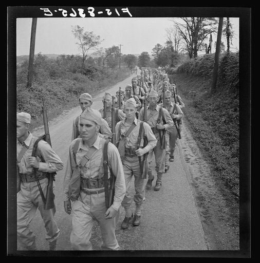 Untitled photo, possibly related to: Fort Belvoir, Virginia (vicinity). Sergeant George Camblair on a march along the road near camp