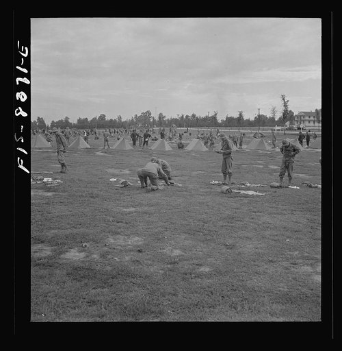 Untitled photo, possibly related to: Fort Belvoir, Virginia. Sergeant George Camblair learning how to make up his pack