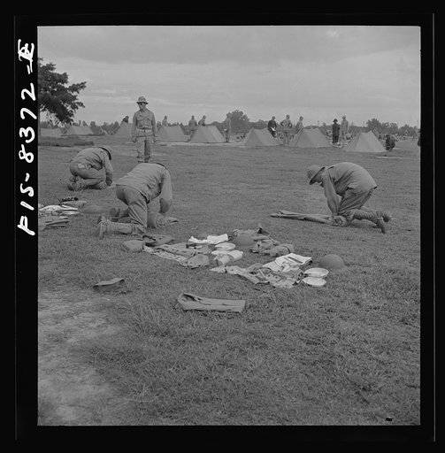 Untitled photo, possibly related to: Fort Belvoir, Virginia. Sergeant George Camblair learning how to make up his pack