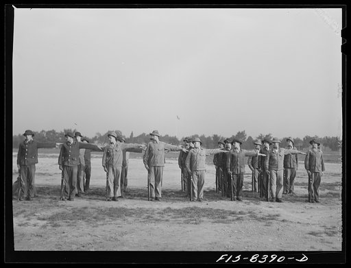 Untitled photo, possibly related to: Fort Belvoir, Virginia. Sergeant George Camblair drilling with the rest of his buddies