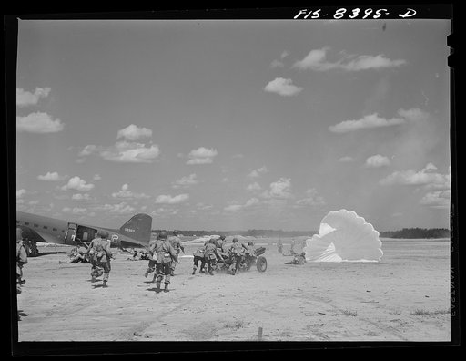 Fort Bragg, North Carolina. Airborne artillery cooperating with parachutists to take over an airfield in a military demonstration