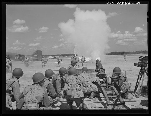 Fort Bragg, North Carolina. Airborne artillery cooperating with parachutists to take over an airfield in a military demonstration