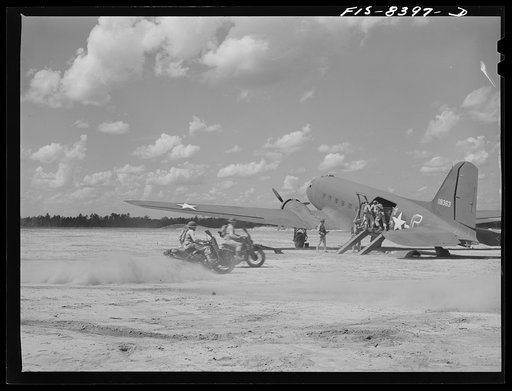 Untitled photo, possibly related to: Fort Bragg, North Carolina. Unloading a jeep from a transport plane in a military demonstration