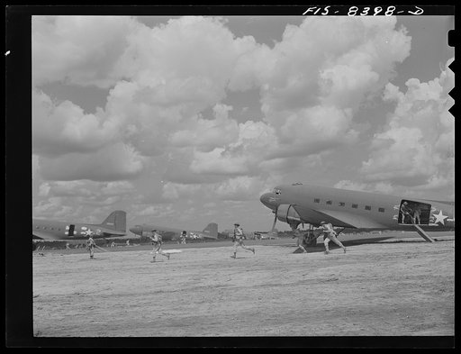 Untitled photo, possibly related to: Fort Bragg, North Carolina. Airborne bicyclists and motorcycles taking over an airfield in a military demonstration