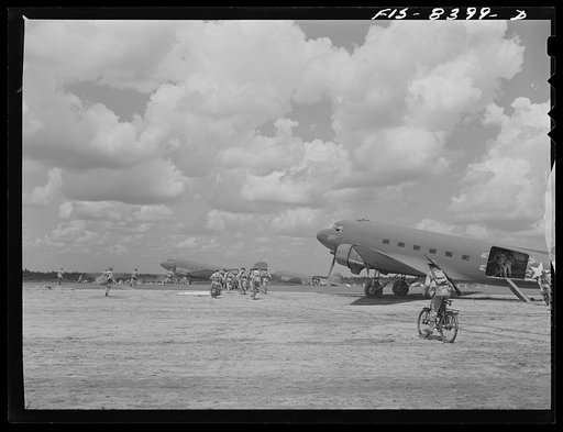 Fort Bragg, North Carolina. Airborne bicyclists and motorcycles taking over an airfield in a military demonstration