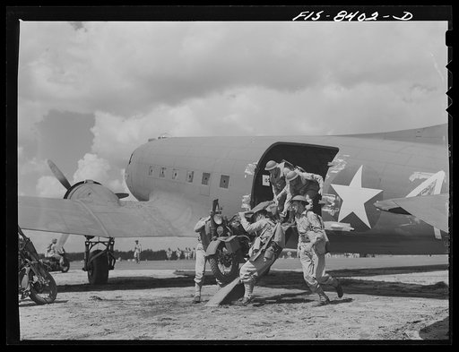 Fort Bragg, North Carolina. Airborne motorcyclists leaving a transport plane in a military demonstration