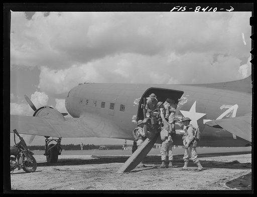 Fort Bragg, North Carolina. Airborne motorcyclists leaving a transport plane in a military demonstration