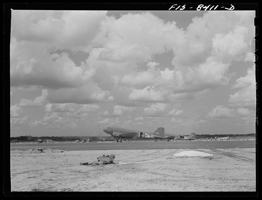 Untitled photo, possibly related to: Fort Bragg, North Carolina. Airborne artillery cooperating with parachutists to take over an airfield in a military demonstration
