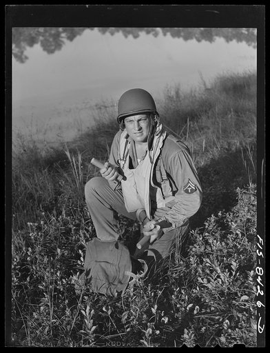 Untitled photo, possibly related to: Fort Bragg, North Carolina. Parachutist with dynamite in a military demonstration