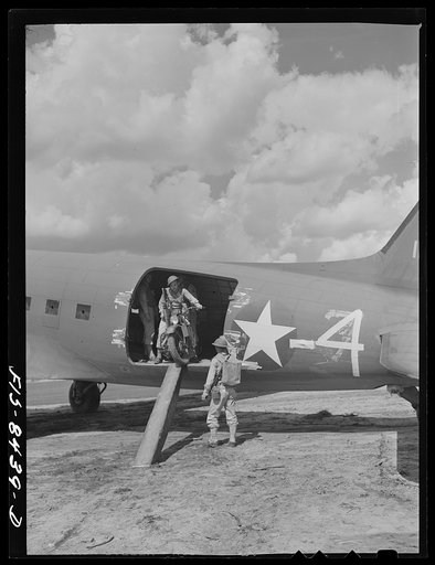 Fort Bragg, North Carolina. Airborne motorcyclists leaving a transport plane in a military demonstration