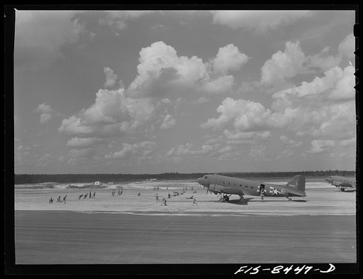 Fort Bragg, North Carolina. Airborne artillery cooperating with parachutists to take over an airfield in a military demonstration
